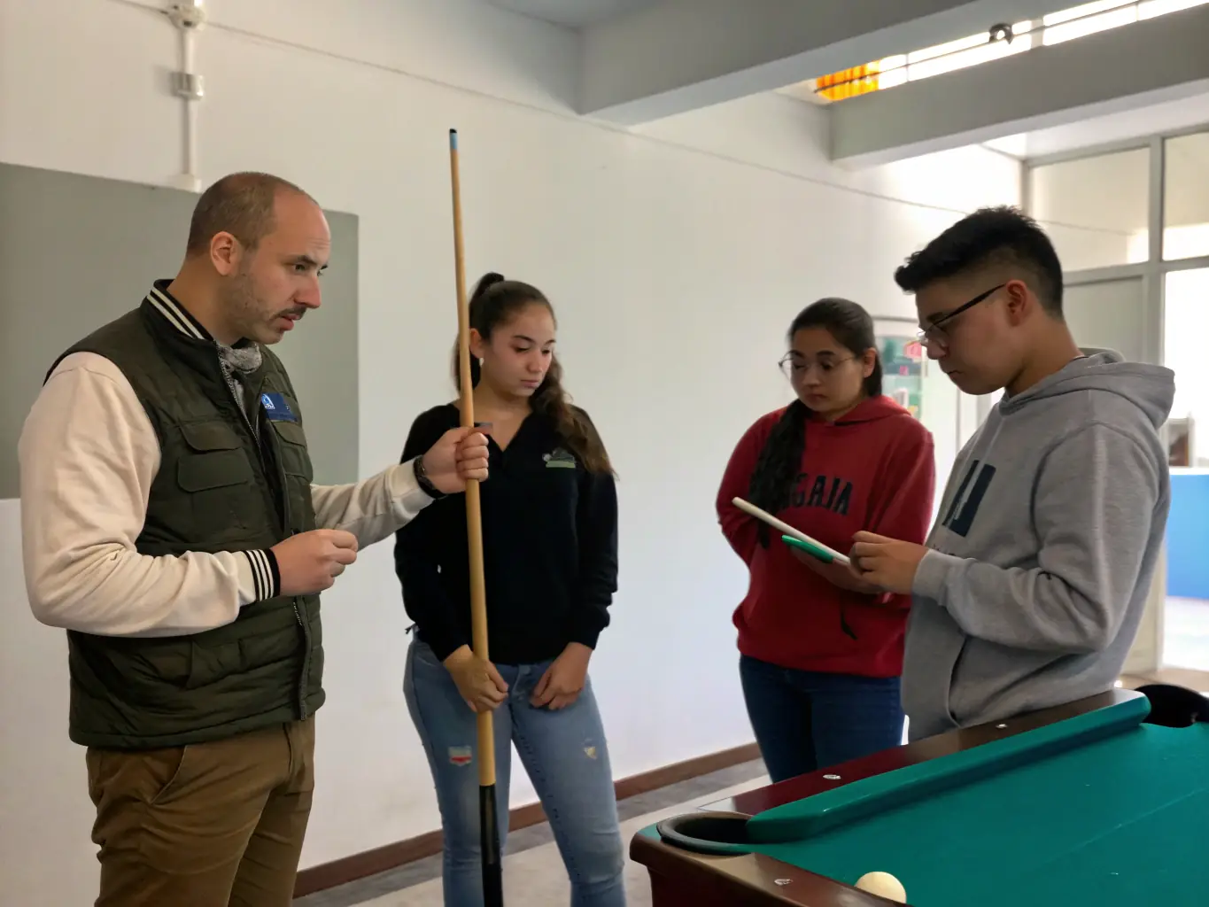 A picture of a billiards coach providing one-on-one instruction to a club member, emphasizing the personalized support available.